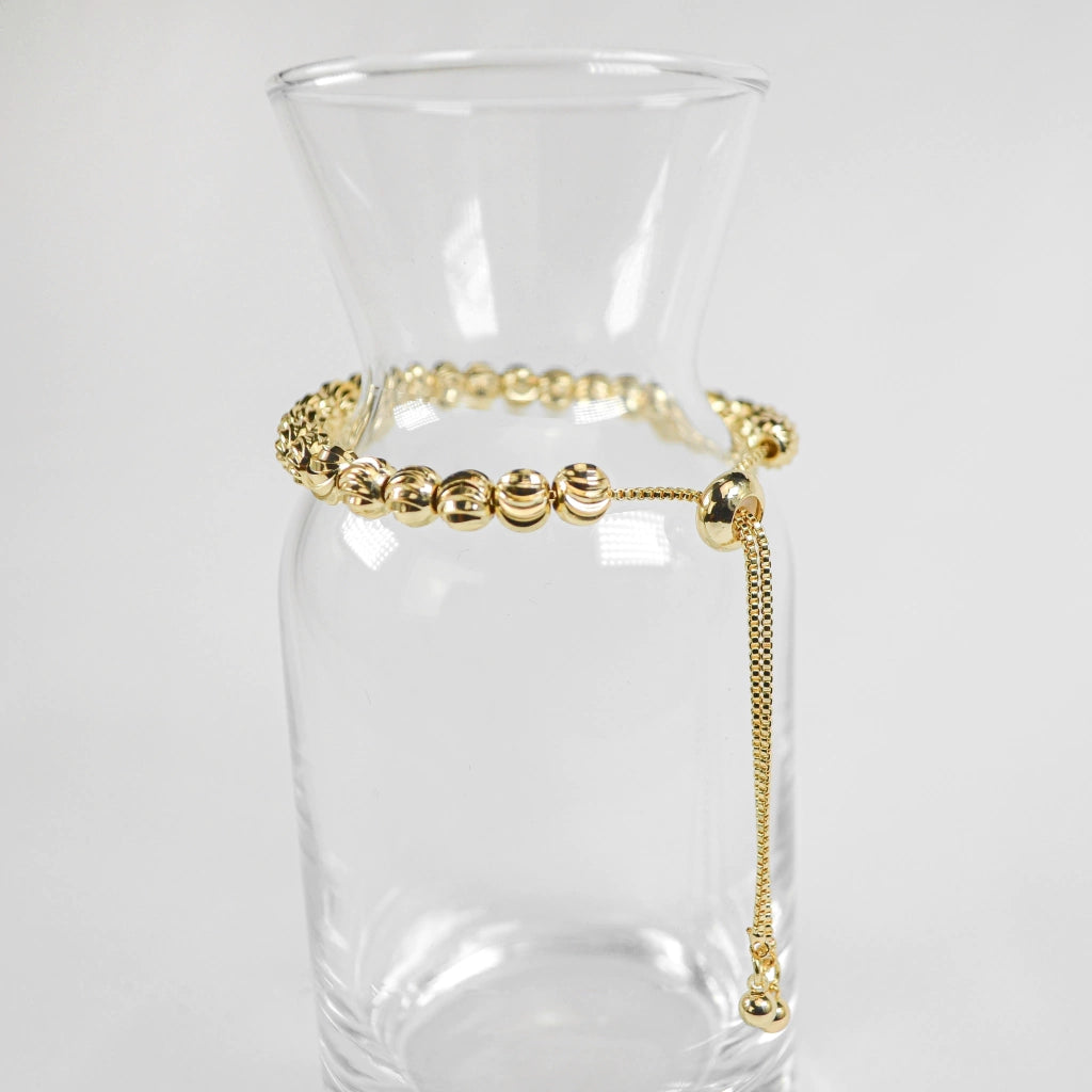 PULSERA VIOLETA DORADA