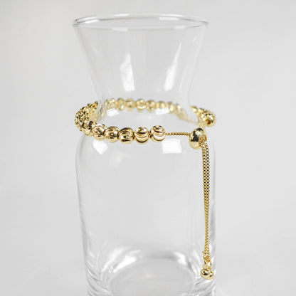PULSERA VIOLETA DORADA