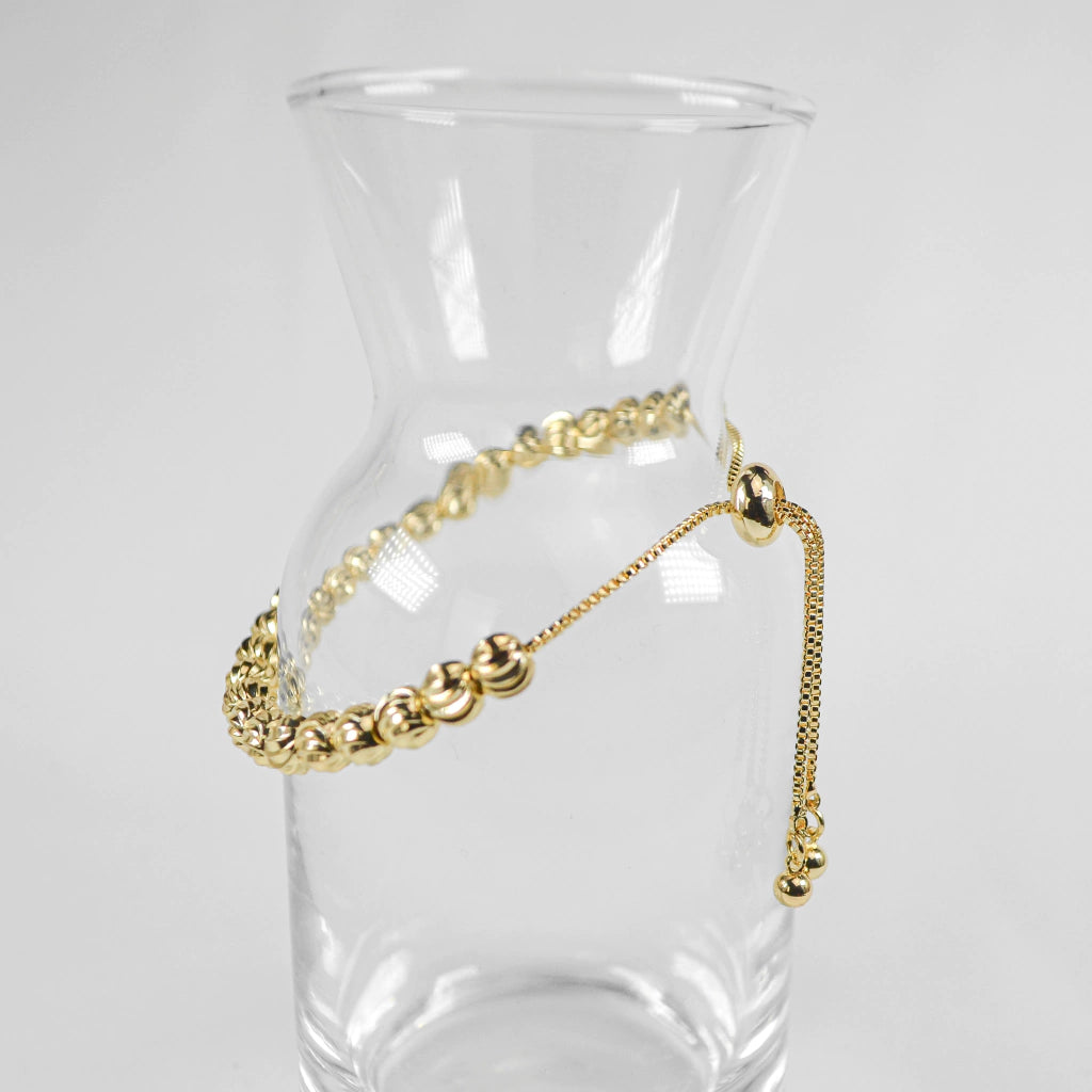 PULSERA VIOLETA DORADA