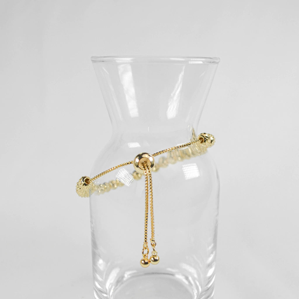 PULSERA VIOLETA DORADA